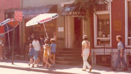 People Walking in Front of the Restaurant 